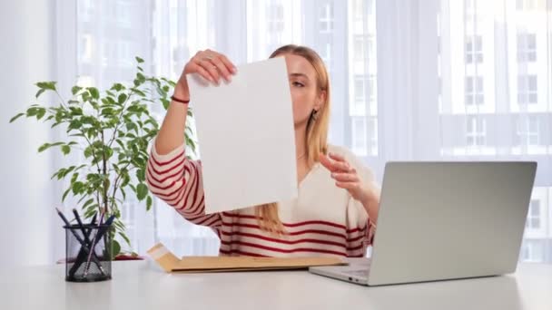 Worried Woman Sitting Table Reads Received Bad News Holds Documents — Stockvideo