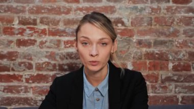 Businesswoman talking to camera making online conference business call, chat. Confident teacher, job applicant doing videocall for distance interview. Woman communicating by videoconference web cam
