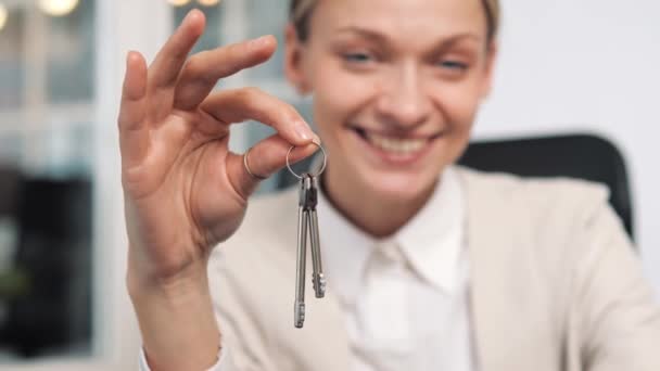Smiling Woman Holding Keys Close Focus Hand Realtor Real Estate — Stockvideo
