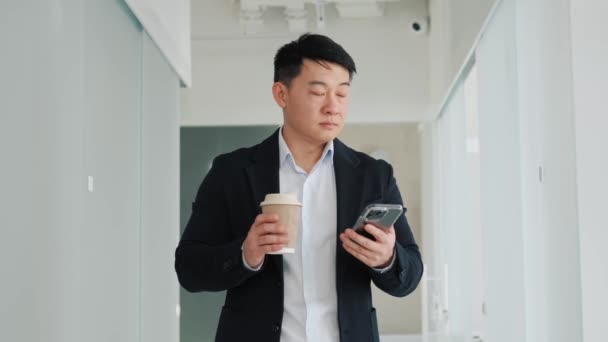 Thinking Korean Businessman Using Mobile Phone Office Hall Holding Morning — Stock video