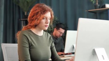 Red Hair Female Corporate Office Worker Feels Stress, Frustration Works on Desktop Pc. Accountant Feeling Project Pressure, Massages Her Head, Works with Statistics, Has Bad Day. Stock Market Crash