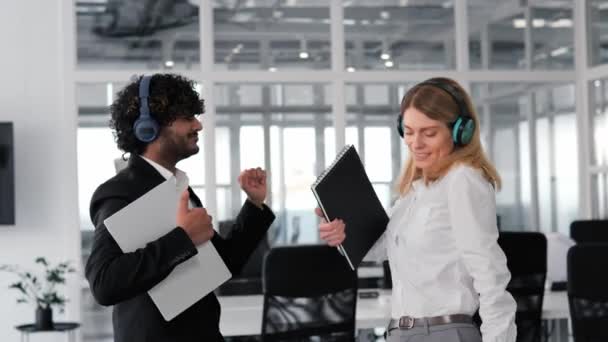 Joyful Diverse Individuals Wearing Wireless Headphones Dancing Having Fun Office — Stock Video