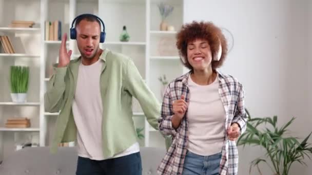 Two African American People Dancing While Listening Music Wireless Headphones — Stock Video