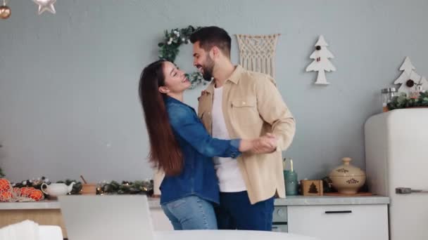 Young Joyful Couple Celebrates Christmas Eve Dancing Festively Decorated Kitchen — Stock Video