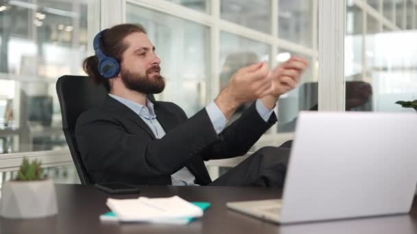 Smiling Caucasian Businessman Wearing Wireless Headset Imagining Himself Orchestra Conductor — Stock Video