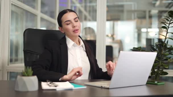 Concentrated Female Manager Sitting Office Desk Stretching While Using Modern — Stock Video