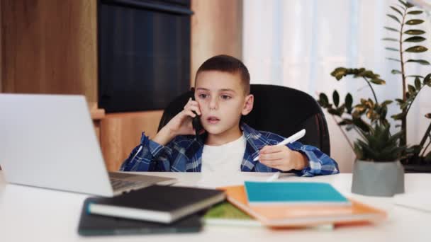 Little Boy Doing Homework Colorful Copybooks Online Class Talking Mobile — Stock Video