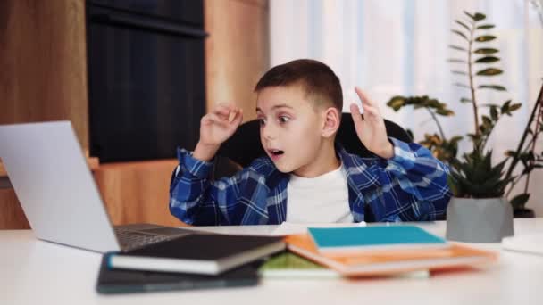 Shocked Male Child Looking Laptop Screen Grabbing Head Hands Indoors — Stock Video
