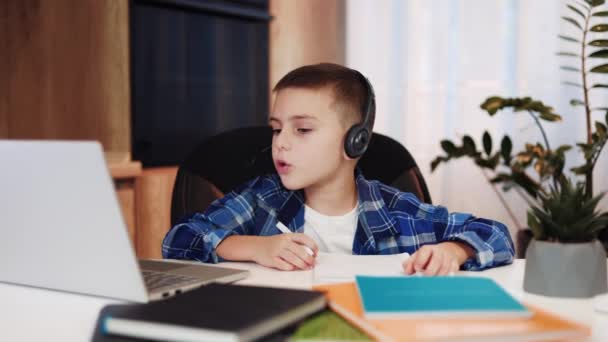 Elementary Student Casual Clothes Using Modern Headset Connected Laptop While — Stock Video