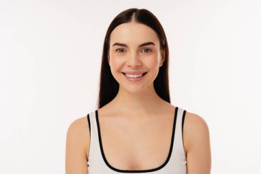 Bright portrait of a smiling girl, showcasing natural beauty and a cheerful expression. Captured against a plain white background, this image conveys positivity, friendliness, and tranquility. clipart