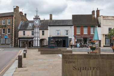 DOWNHAM MARKET, NORFOLK, UK, JULY 11. View of the Clocktower at Downham Market, Norfolk, UK on July 11, 2024. Three unidentified people clipart