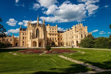 Lednice Chateau, a magnificent Neoclassical chateau located in the Lednice-Valtice Cultural Landscape, a UNESCO World Heritage Site. The chateau, surrounded by stunning gardens and vineyards. clipart