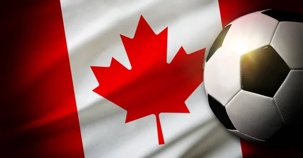 stock image Canada national team composition with classic ball on grass and flag in the background. Top view.