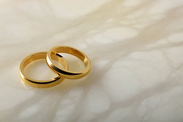 Detail Two Gold Wedding Rings Lying One Other White Marble — Stock Photo, Image