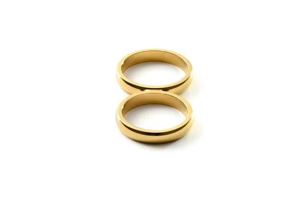 Λεπτομέρεια Από Χρυσά Δαχτυλίδια Εμπλοκής Σχηματίζοντας Οκτώ Λευκό Απομονωμένο Φόντο — Φωτογραφία Αρχείου