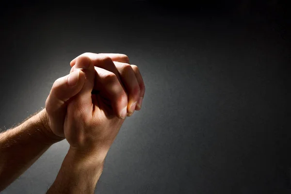 Praying Man Hands Fingers Interlocked Contrasted Beam Light Dark Isolated — Stock Photo, Image