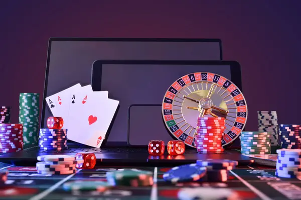 Casino online gaming concept with mobile devices and gaming objects in front with isolated background. Front view.