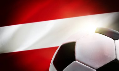 Avusturya futbolunun arka planında top ve ülkenin bayrağı var.