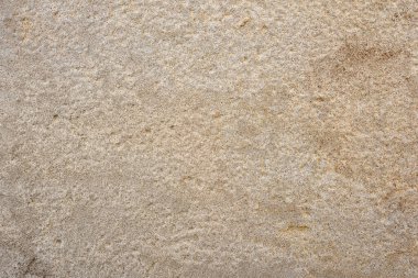 Düz bej taş levhanın Macro detay arka planı. Üst görünüm.