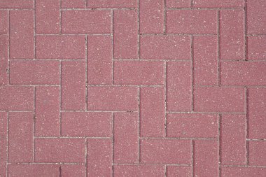 Kırmızımsı kaldırım döşeme ayrıntıları şık bir şablonla döşenmiş. Üst görünüm.