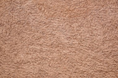 Arka planda koyu kahverengi dış cephe duvarının makro ayrıntıları var. Ön görünüm.