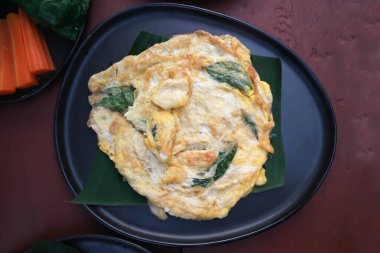 omelette, omelet or  fried egg with tea leaf or fried egg with vegetable or Thai omelet