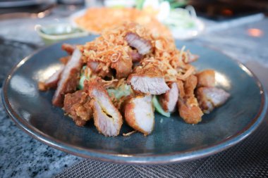 fried pork, pork or deep fried porkwith fried garlic for serve