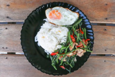 stir fried morning glory or stir fried vegetable with rice and sunny side up egg or Thai food for serve