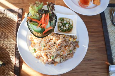 stir fried rice, fried rice with vegetable salad for serve