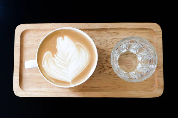 coffee or hot coffee, latte coffee or hot latte coffee and water in the wooden tray