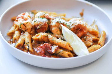 prawn pasta, prawn penne or shrimp pasta or penne prawn with tomato sauce for serve