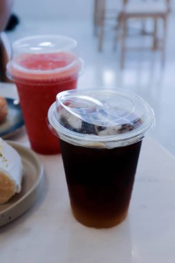 americano coffee or iced americano and strawberry smoothie for serve