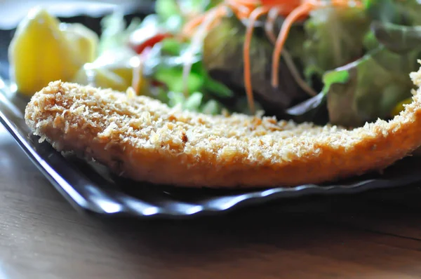 stock image fried fish with tomato gravy and salad or fish and chips with dressing