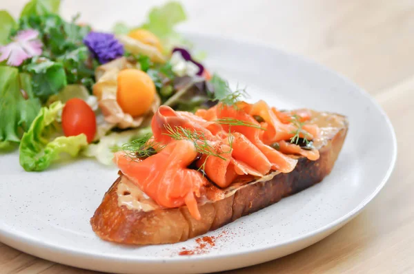 stock image salmon canape or bread with salmon and caviar topping ,salad