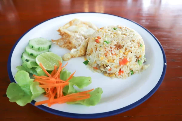 stir fried rice or fried rice with sunny side up egg and vegetable