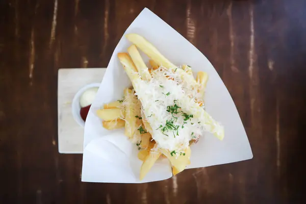 French fries or fried potato ,cheese fries or french fries with cheese topping for serve