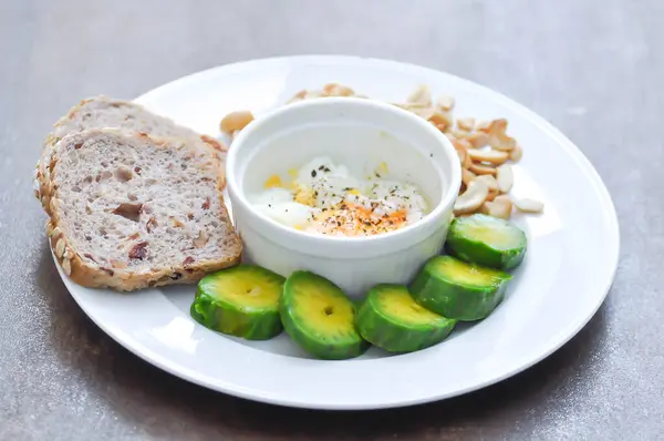 stock image whole wheat bread or sourdough bread with nuts , avocado and soft boiled egg for serve