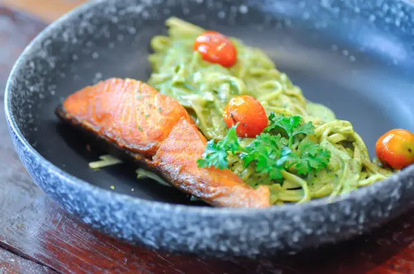 stock image salmon pasta or pesto salmon pasta , pasta with green sauce or p