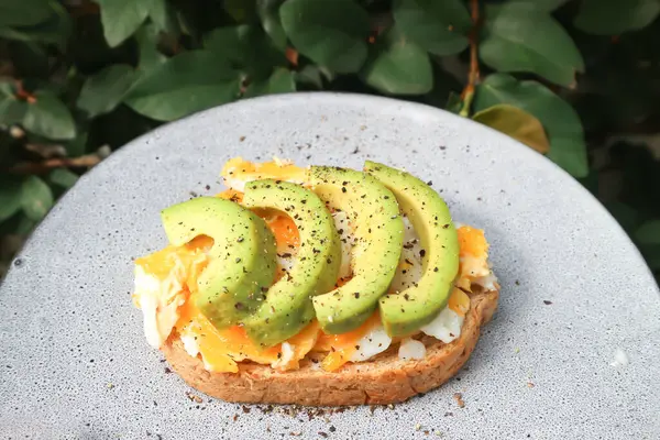 stock image bread with egg and avocado topping for serve