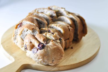 walnut cranberry sourdough bread or cranberry sourdough in the wooden tray clipart