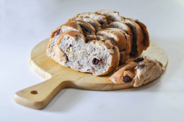 walnut cranberry sourdough bread or cranberry sourdough in the wooden tray clipart