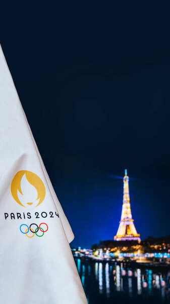 PARIS, FRANCE, AUGUST 8. 2022: Summer olympic game Paris 2024 black background. Official logo 2024 in Paris on white blanket dark Tower in night. Black edit space, Vertical ratio 16:9 for smartphone.