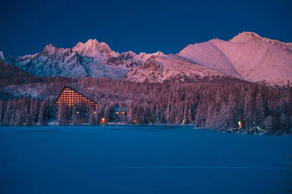 Silent winter evening at Strbske Pleso under High Tatras, the darkness creeping in