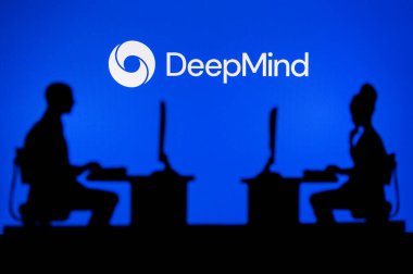 JAPAN, TOKYO. JANUARY 30, 2023: DeepMind from Google. A Glimpse into the Tech World: Silhouette of Software Developers with Company Logo Behind Them