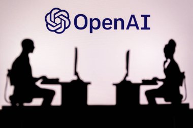 LOS ANGELES, USA, JANUARY 30, 2023: Open AI. A Glimpse into the Tech World: Silhouette of Software Developers with Company Logo Behind Them
