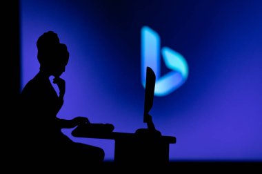 INDIA, NEW DELHI. JANUARY 30, 2023: Bing Inspiring Women in the World of Technology: Silhouette of a Female Software Develope clipart