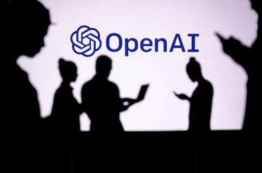 INDIA, NEW DELHI. JANUARY 30, 2023: Open AI. Web Development Dreams Come True: Silhouetted Developers in Discussion with Company Logo