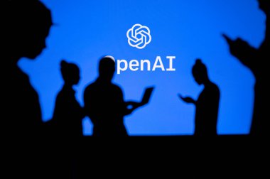 UK, LONDON. JANUARY 30, 2023: Open AI. Innovating Together: Silhouetted Web Developers Uniting for Progress with Company Logo in Background