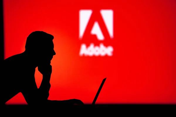 London January 2023 Adobe Unleashing Power Internet Silhouetted Man Uses — Zdjęcie stockowe