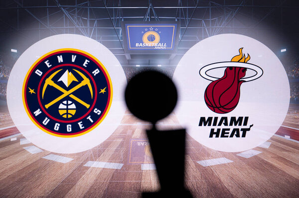 MIAMI, USA, MAY 31, 2023: Glimpses of Greatness: Denver Nuggets vs Miami Heat Clash in the NBA Finals, with the Iconic Larry O'Brien Championship Trophy as a Silhouette